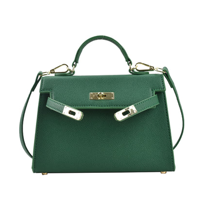 A woman carrying a small square bag with a lock
