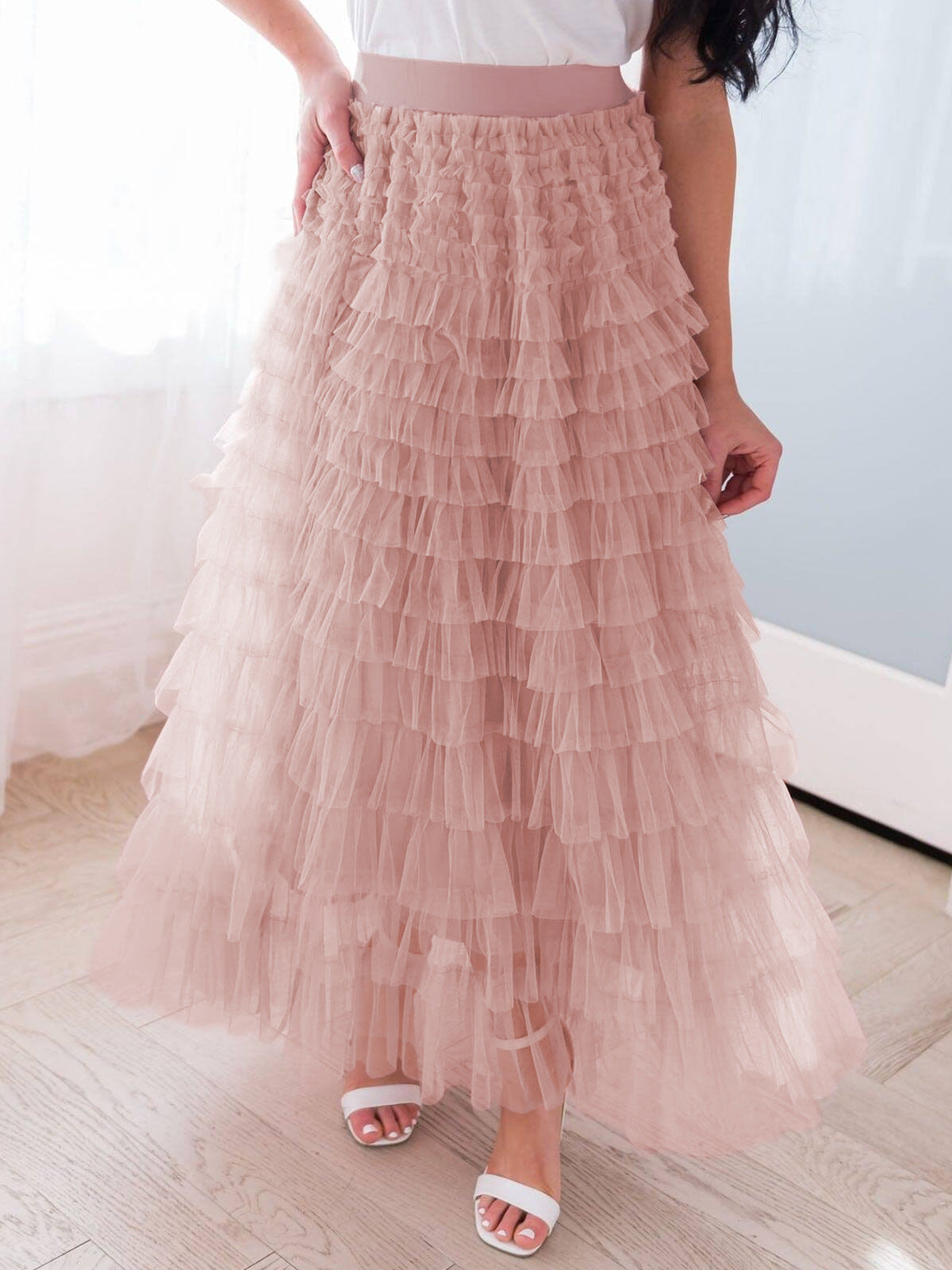 A woman in a lace cake skirt